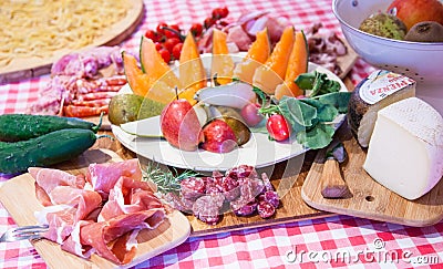 Typical Tuscany cuisine with prosciutto and fruit. Stock Photo