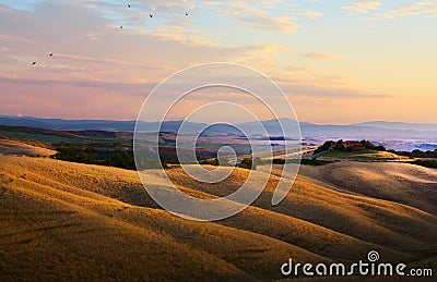 Typical Tuscany landscape; sunset over rolling hills and Tuscany Stock Photo