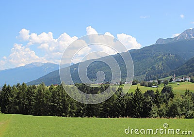 Typical view over the Alps with small village Stock Photo