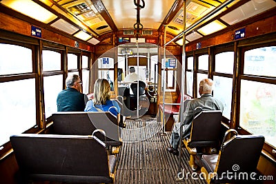 Typical yellow tram interior, Lisbon, Portugal. Editorial Stock Photo