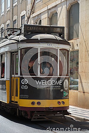 Typical Yellow Vintage Tram in Narrow Street of Lisbon, Portugal Editorial Stock Photo