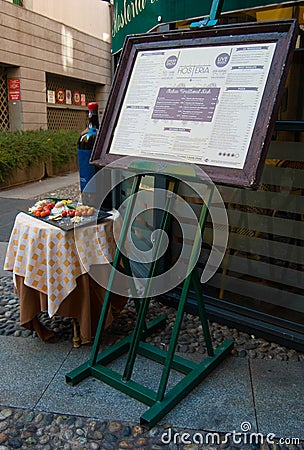 Typically Italian menu exposed outside a restaurant with some in Editorial Stock Photo