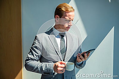 Business man holding mobile phone Stock Photo