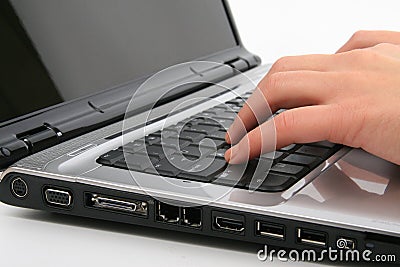 Typing on laptop Stock Photo