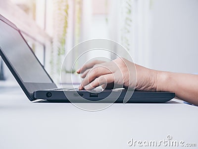 Typing on laptop keyboard Stock Photo