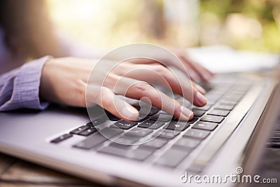 Typing, woman hands and laptop in garden for university research, college application or remote work outdoor. Park Stock Photo