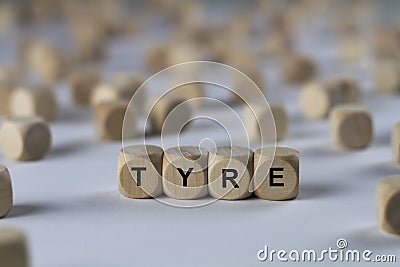 Tyre - cube with letters, sign with wooden cubes Stock Photo