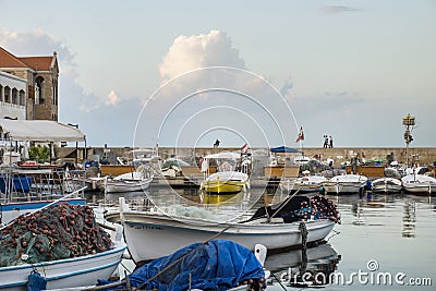 People and army on the wall of the fishing harbour of Tyre, Lebanon Editorial Stock Photo