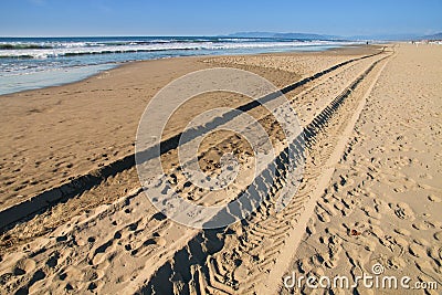 Tyre tracks on the beach Stock Photo