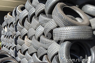 Tyres stacked for recycling Stock Photo