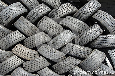 Tyres stacked for reuse Stock Photo