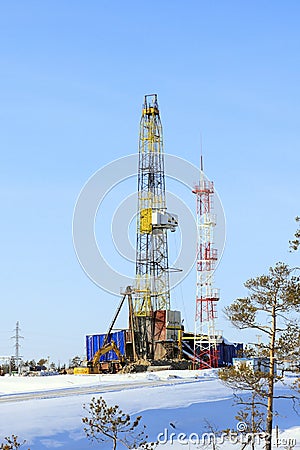 Industrial winter landscape with a drilling rig in the North of Western Siberia Editorial Stock Photo