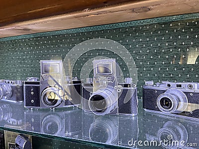 Tyumen, Russia-July 28, 2022: Old retro cameras in the museum, an exhibition of old photo accessories. The history of Editorial Stock Photo