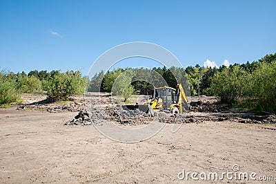 Tyumen, Russia, July 6, 2021: tractor, excavator, bulldozer stuck in sand and clay on the shore Editorial Stock Photo