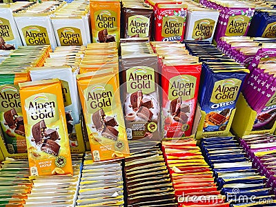 Tyumen, Russia-June 14, 2023: Counter with different types of Alpen Gold chocolate in a supermarket. Selective focus Editorial Stock Photo