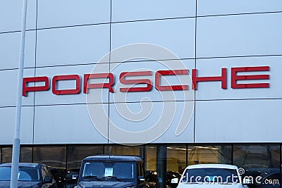 Tyumen, Russia-March 18, 2024: Cars parked in rows in front of a Porsche dealership, showcasing various models and Editorial Stock Photo