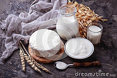 Tzfat cheese, milk and wheat grains. Symbols of judaic holiday S Stock Photo