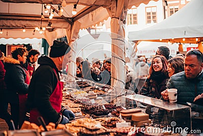 TÃ¼bingen, Germany - December 6, 2019: Chocolate market chocolART with christmas booths and stalls with many people standing in Editorial Stock Photo