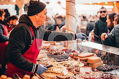TÃ¼bingen, Germany - December 6, 2019: Chocolate market chocolART with christmas booths and stalls with many people standing in Editorial Stock Photo