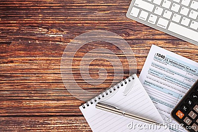 U.S. Individual Income Tax Return, Calculator and a Pen, Computer Keyboard Tax Form 1040 Editorial Stock Photo