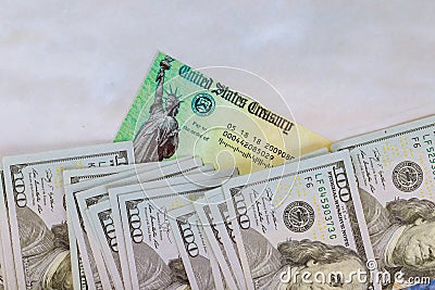 1040 U.S. Individual Income Tax Return, Stimulus economic tax return check and USA currency hundred US dollar bills Stock Photo