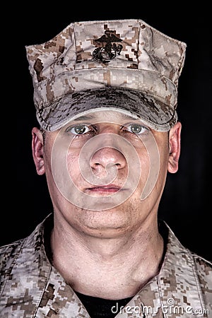 U.S. Marine in patrol cap studio portrait on black Stock Photo