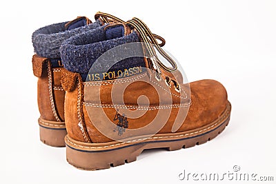 U.S. Polo Assn. brown hiking shoes and a white background, Sturdy hiking boots Editorial Stock Photo