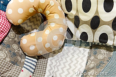 U shaped pillows on the patterned cushion Stock Photo