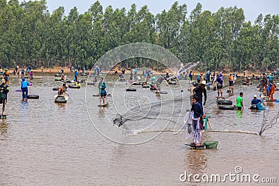 Ubon Ratchathani, Thailand - March 20, 2020 : Many Thai people casting a net for catching fish at river. Fishermen show ancient Editorial Stock Photo