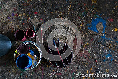 UBUD/BALI-APRIL 27 2019: colorful paint bucket with a brush and the floor is filled with beautiful solid color because the paint Stock Photo