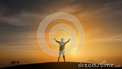 Uccessful concept, Silhouette man stand on the top of mountain a Stock Photo