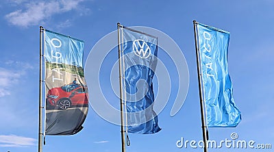 Advertising banners of Volkswagen and its car model Taigo outside the local dealer of the german automaker. Editorial Stock Photo