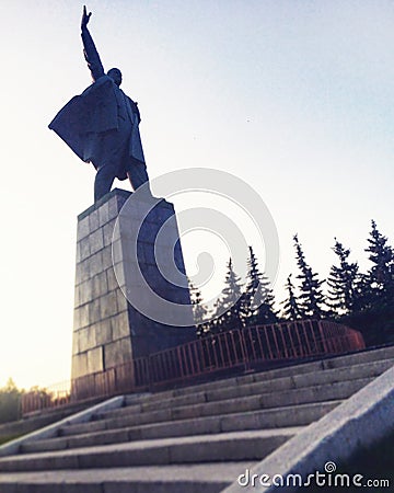 UFA, RUSSIA - 1 june 2016: silhouette Sculpture of Vladimir Ilyich Lenin in the town square against the sky and stairs. Concept Editorial Stock Photo