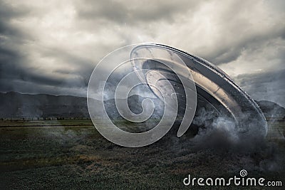 UFO crashing on a crop field Stock Photo