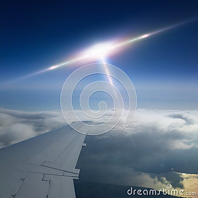 Ufo flies near airplane Stock Photo