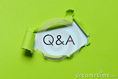 UFO green torn paper written with Q&A. Questions and answers. Stock Photo