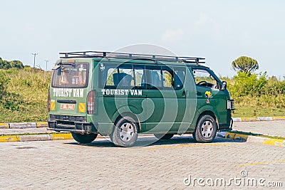 Tourist safari van parked in a parking lot, taking tourists to see wildlife Editorial Stock Photo
