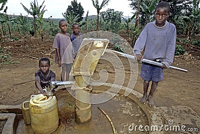 Ugandan Children fetch water at water pump Editorial Stock Photo