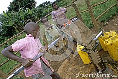 Ugandan Children fetch water at water pump Editorial Stock Photo