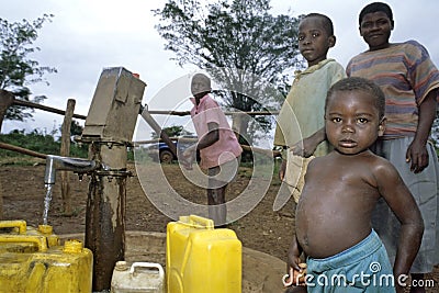 Ugandan Children fetching water at water pump Editorial Stock Photo