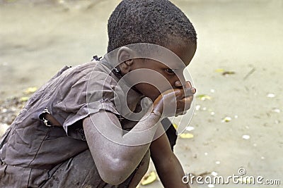 Ugandan girl drinks unclean water Editorial Stock Photo
