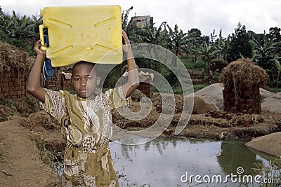 Ugandan Girl at well carrying drinking water Editorial Stock Photo