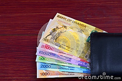 Ugandan Shilling in the black wallet Stock Photo