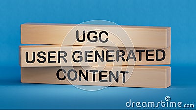 UGC user generated content symbol. Concept words UGC user generated content on wooden blocks.UGC user generated content concept. Stock Photo