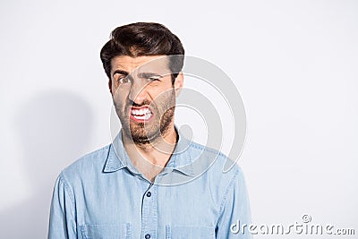 Ugh. Photo of amazing mixed race guy looking disgusted on spoiled food terrible smell wear casual denim shirt isolated Stock Photo