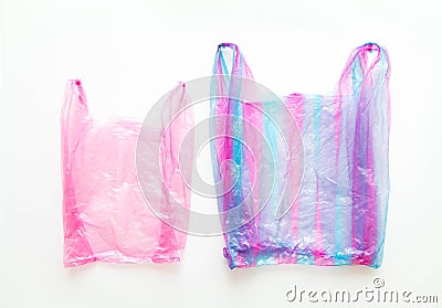 Ugly colorful disposable plastic bags on white background, top view Stock Photo