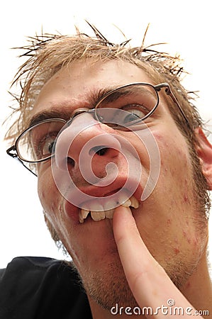 Ugly man picking his crooked teeth Stock Photo