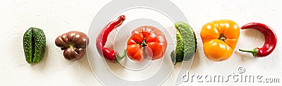 Ugly organic colorful tomato, pepper, cucumber on white concrete table Stock Photo