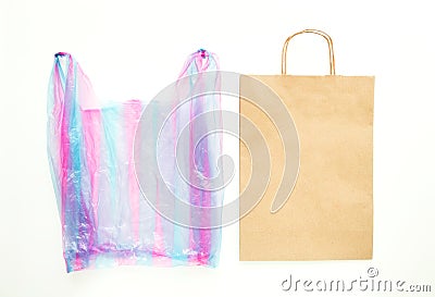 Ugly plastic bag vs brown paper recyclable bag. Reduce, Reuse and Recycle concept. Flat lay Stock Photo