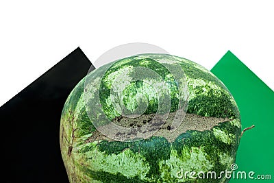 Ugly shaped watermelon with scar-like structure, scratch on white background Stock Photo
